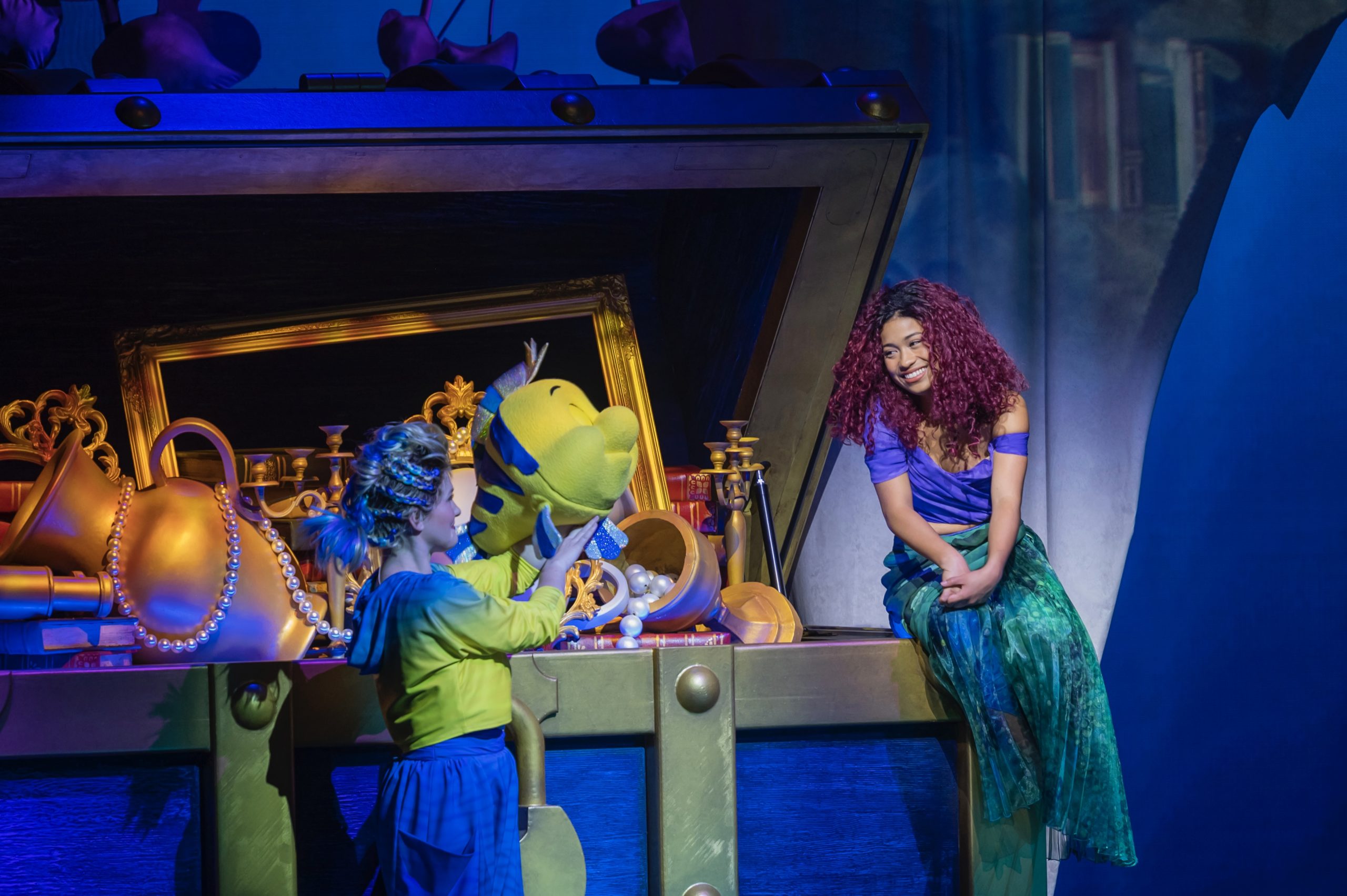 Ariel and Flounder during the theatrical production of The Little Mermaid onboard the Disney Wish cruise ship