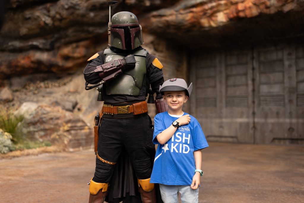 Wish kid Lucas poses with Boba Fett