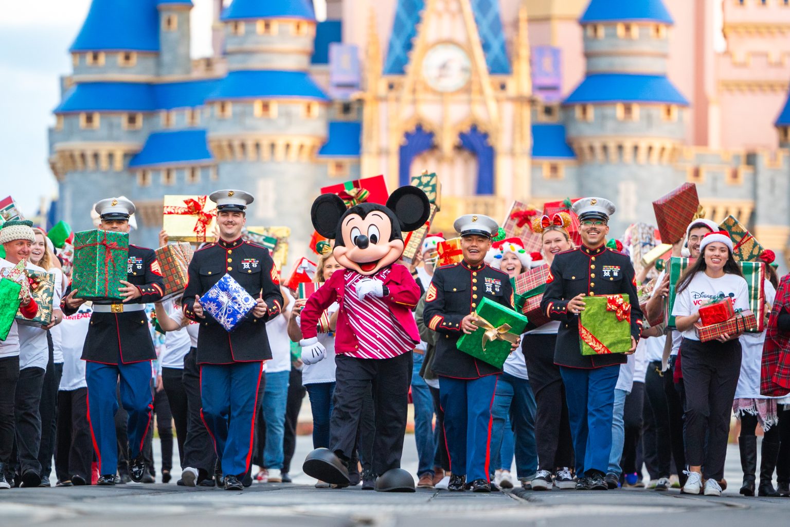 Mickey walking down Main Street for the Ultimate Toy Drive