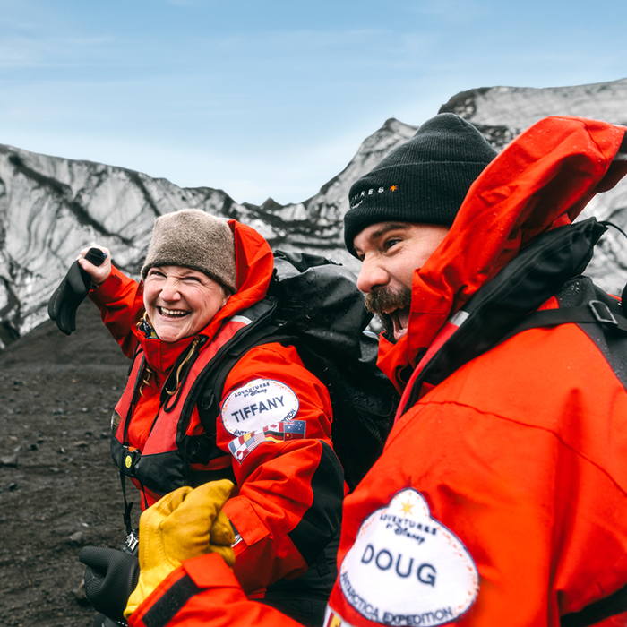 Two Adventures by Disney guides exploring a glacier