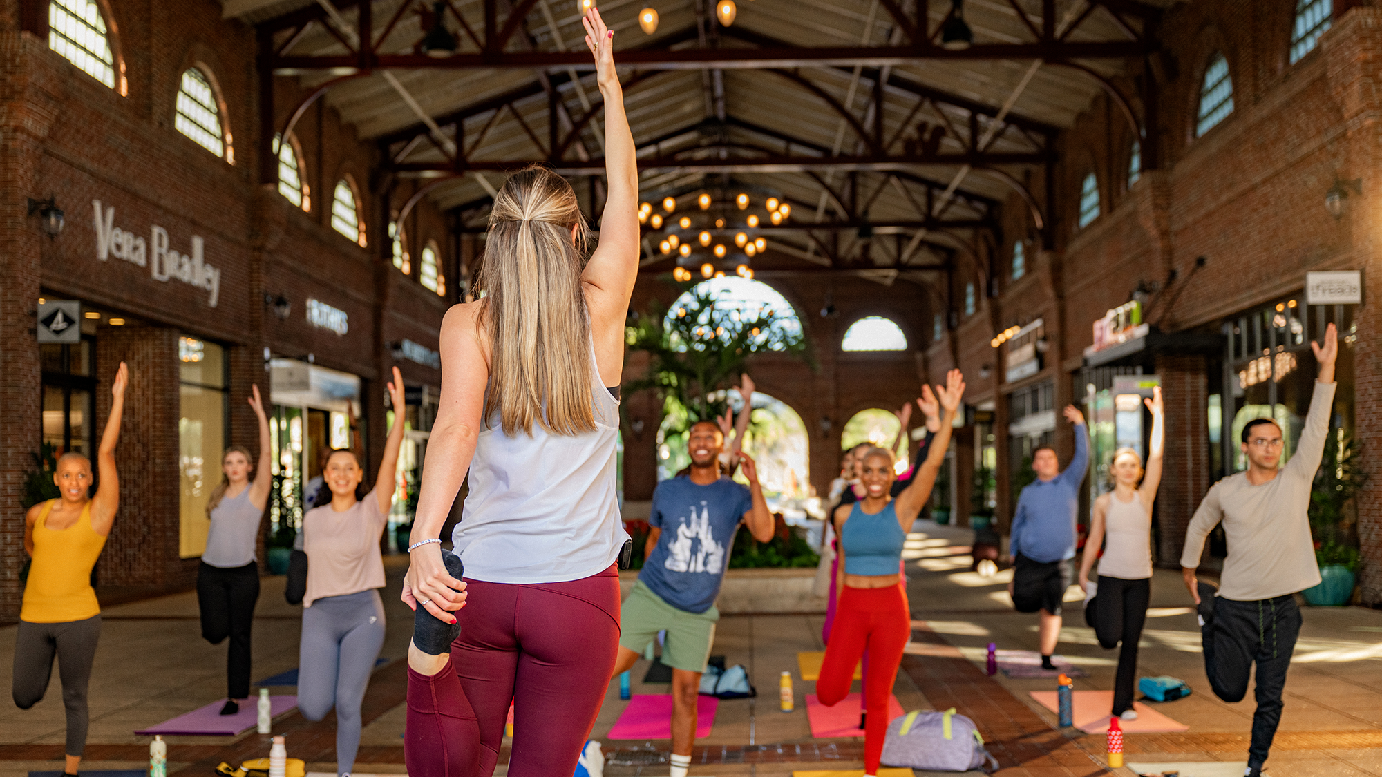 Cast members doing yoga in Disney Springs