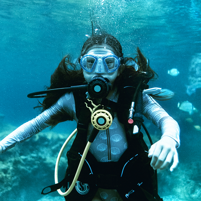 Girl snorkeling under water