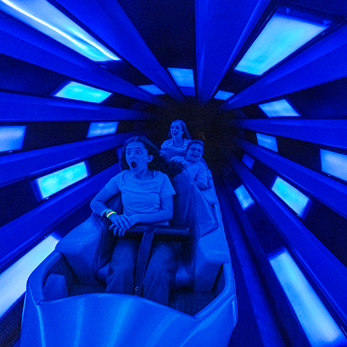 Guests riding Space Mountain at Magic Kingdom