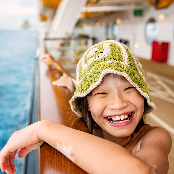 Girl smiling on a Disney Cruise Line ship