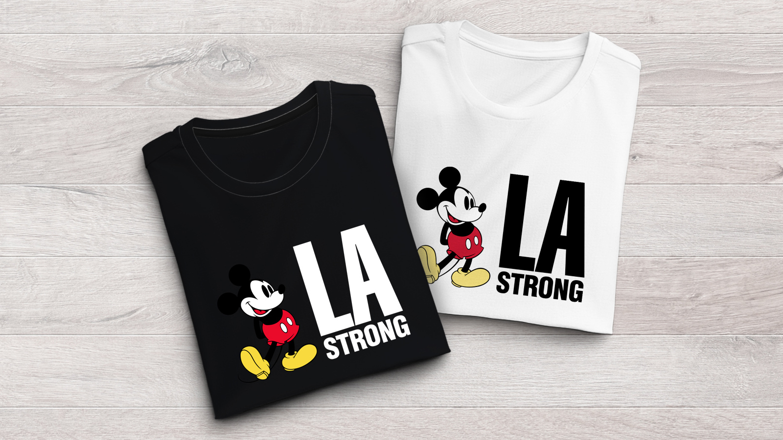 Two t-shirts with Mickey Mouse and LA Strong slogan