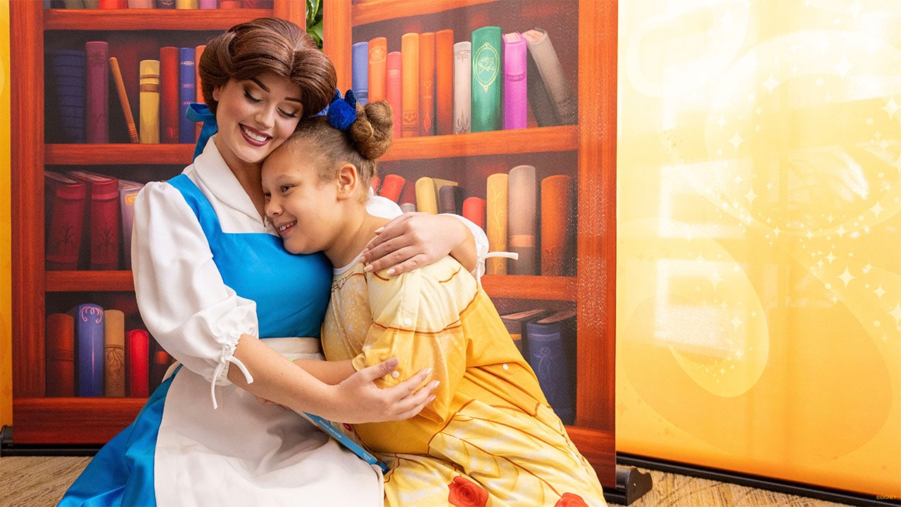 Belle hugging a child