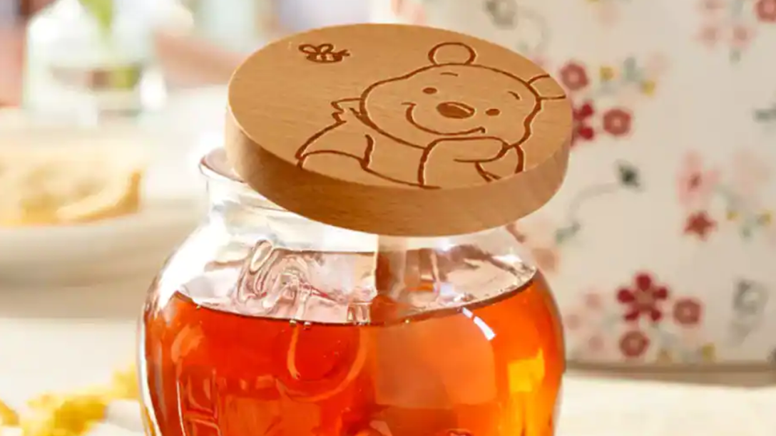 Honey jar with Pooh Bear on the lid.