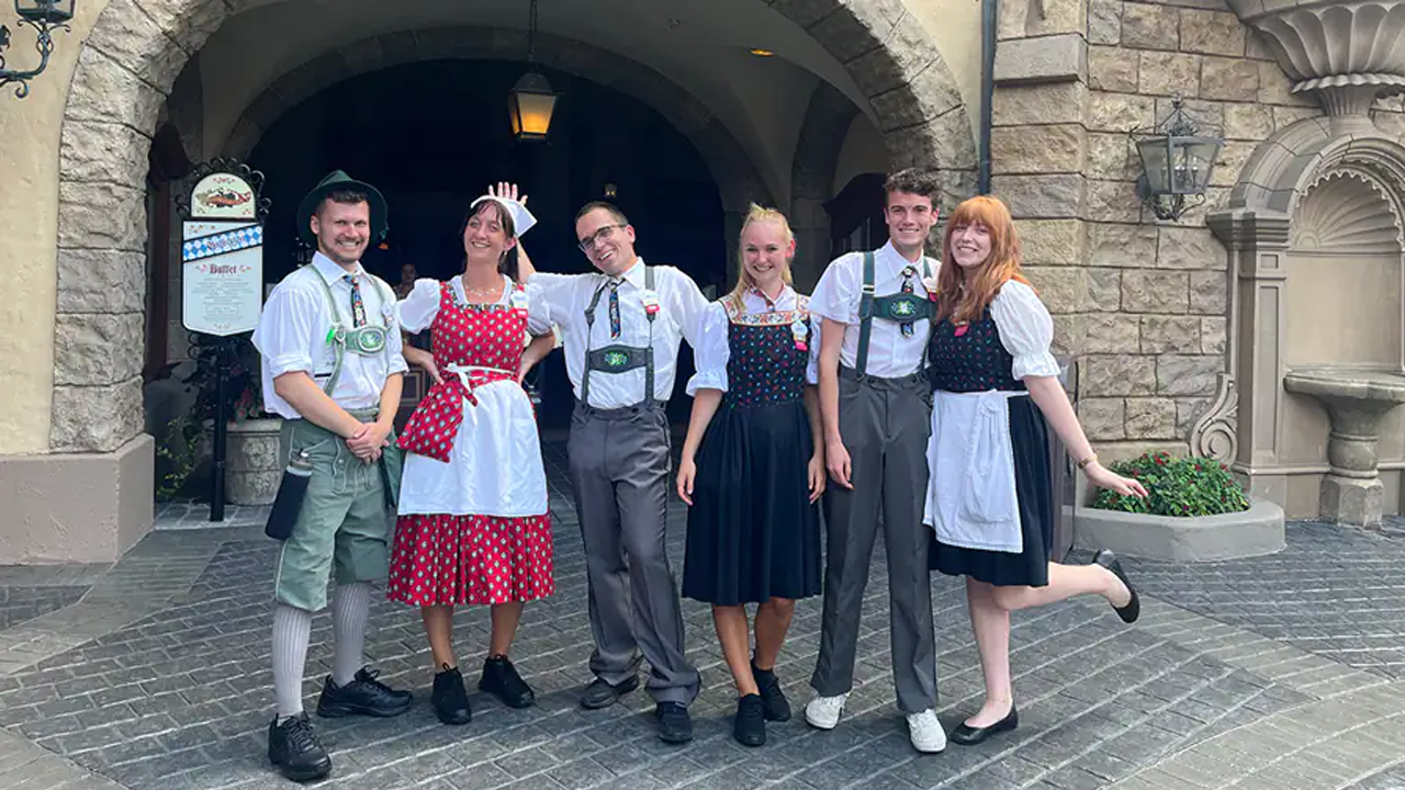 Six German Cultural Representatives pose for a picture together outside of the Germany Pavilion. 