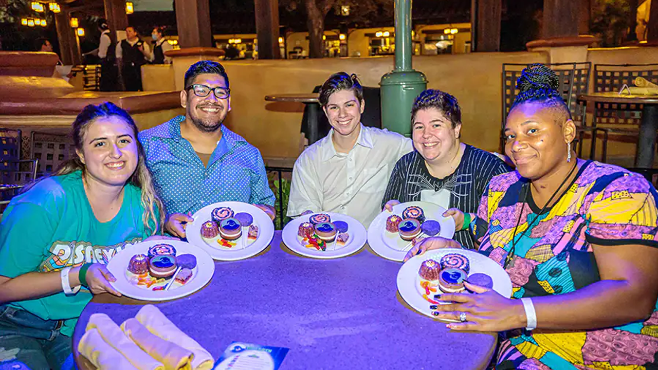 Cast Members enjoying Halloween treats. 