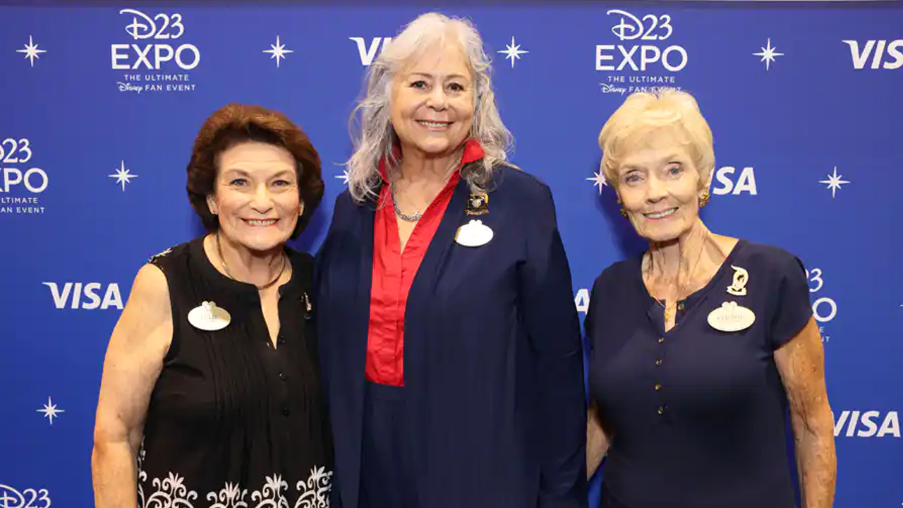 Early Disney Ambassadors post for a picture together including the first and second Disneyland Ambassador and the first Walt Disney World Ambassador. 