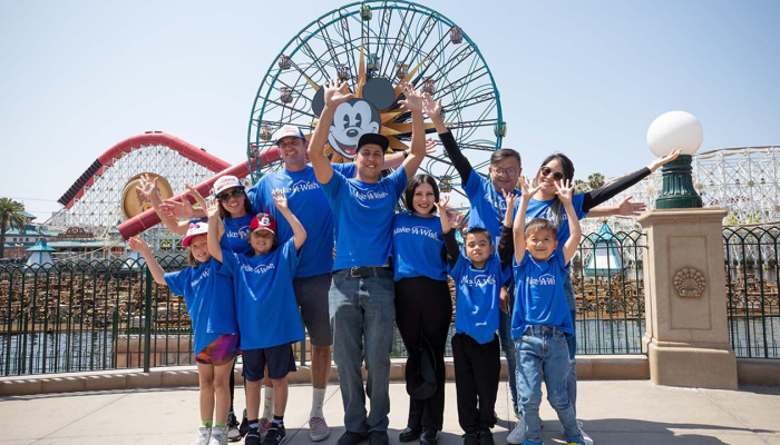 Wish Family poses for a photo at Disney's California Adventure's Paradise Pier