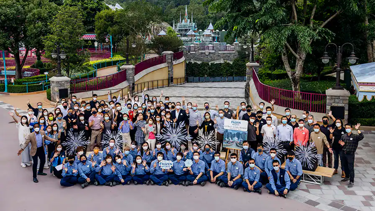 Large team photo outside of the Frozen land. 