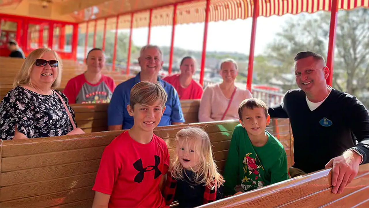 John with his family on the train. 