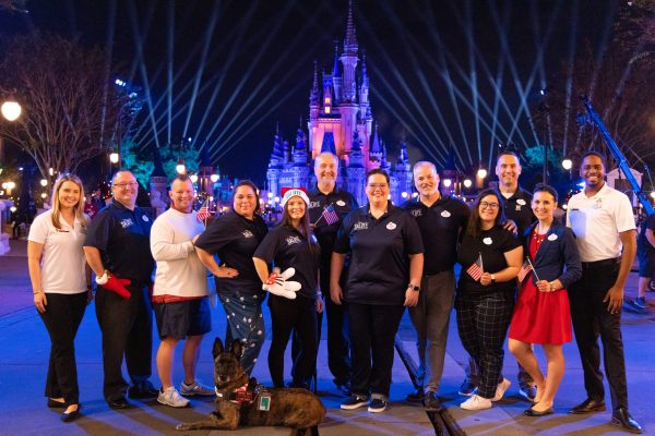 Disney SALUTE BERG members in from of Cinderella Castle