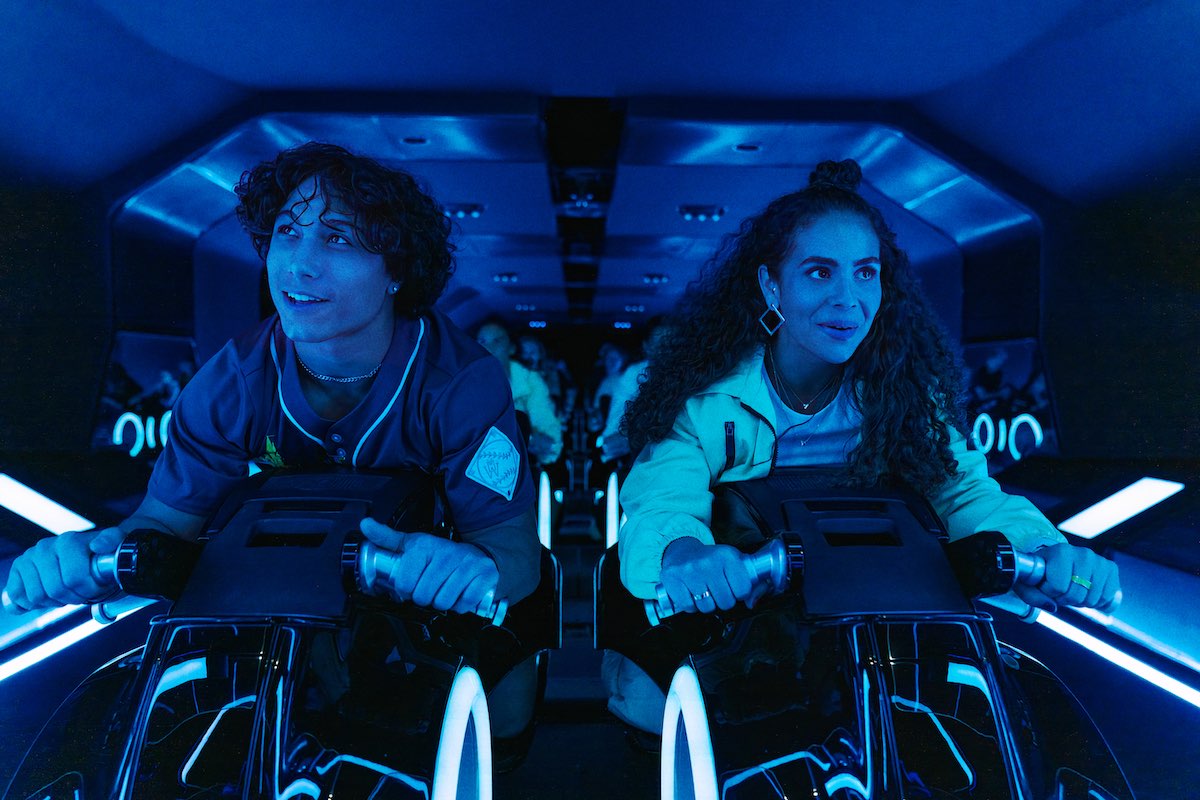 Guests riding Lightcycles on the TRON Lightcycle Run attraction