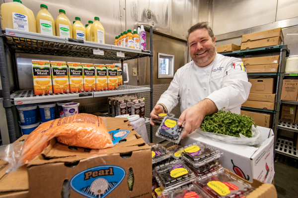 Disney chef prepares food to donate to the local community