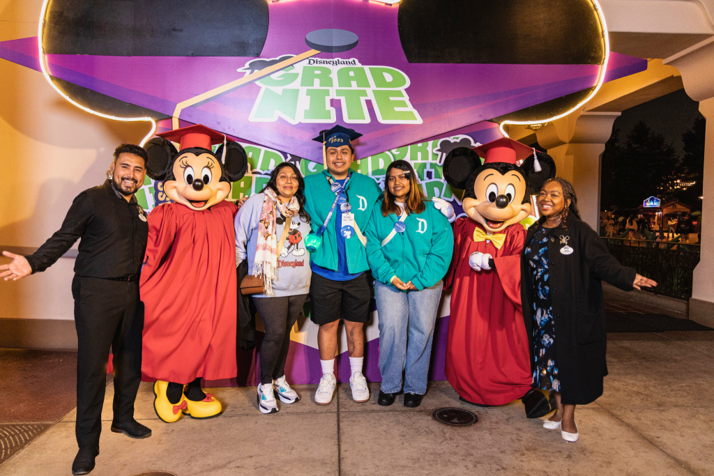 Roel pictured with his family, Mickey and Minnie, Disney Ambassadors of Disneyland Resort.