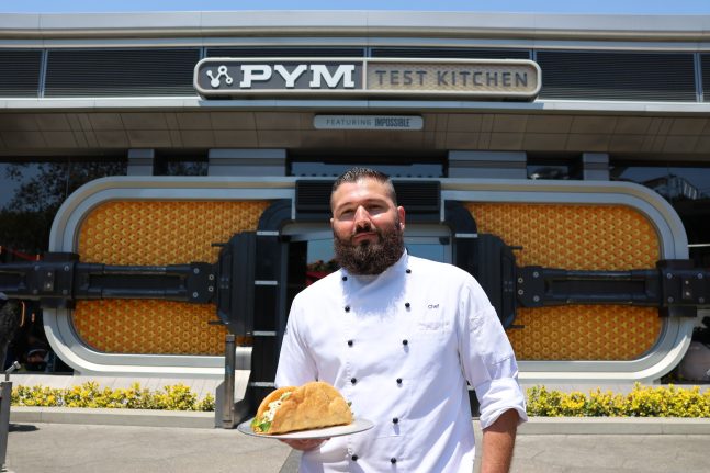 Chef Montoya shows off his creation of the Humongous Taco Salad at Pym Test Kitchen.