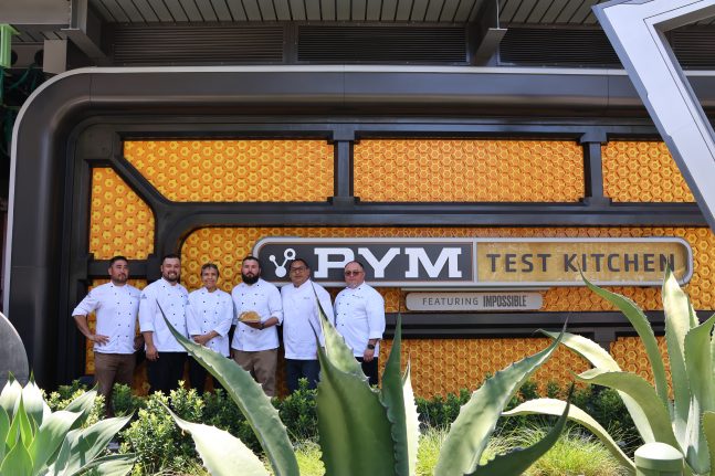 Chef Montoya (fourth from left) stands alongside his fellow team members who helped create the Humongous Taco Salad, a new addition to the Pym Test Kitchen menu.