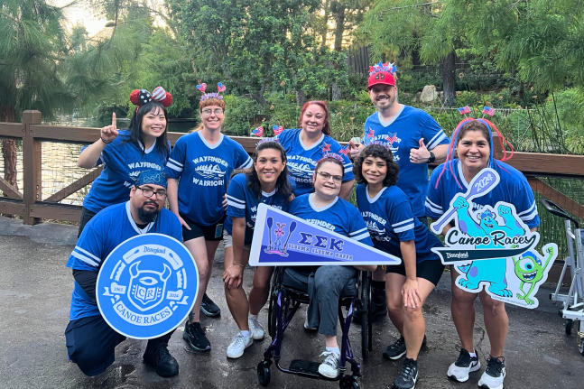 The Wayfarer Warriors canoe team includes Disneyland employees with various roles.