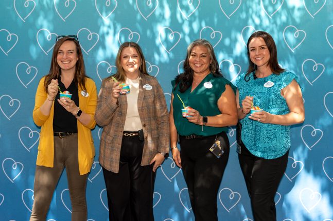 Stage Manager Kaitlyn (second from left) enjoys Happy Ice at the Cast Care Center grand celebration alongside fellow leaders. 