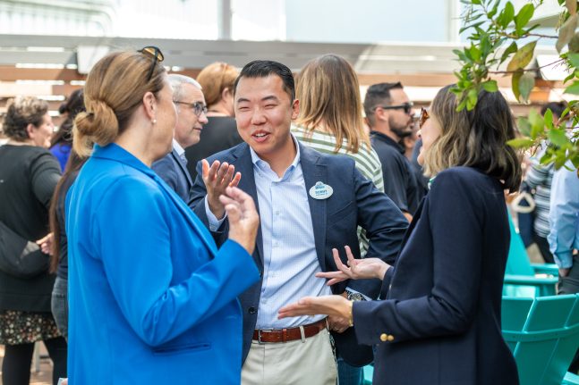 Cast Care Program Manager Sunny Park chats with other Cast Care Leaders. 