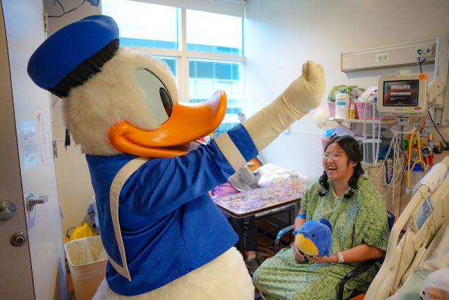 Donald Duck creates joyful memories with a patient at CHOC. 