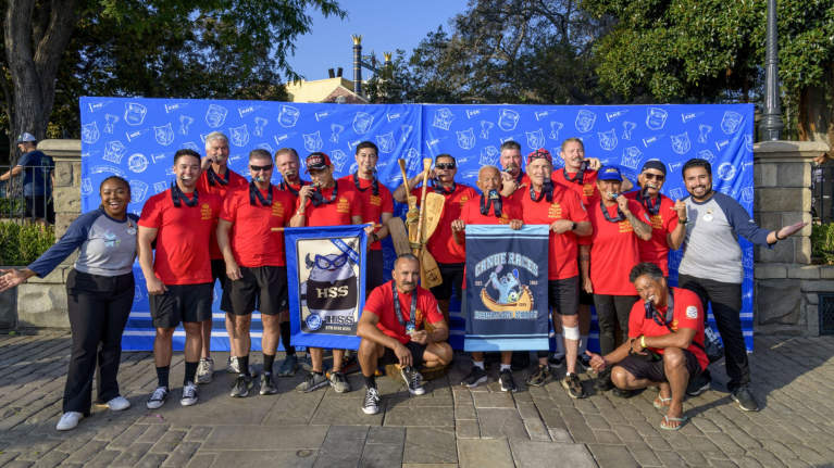 Hank and his fellow Disneyland Resort firefighters celebrate their 2024 Disneyland Resort Canoe Races victory.