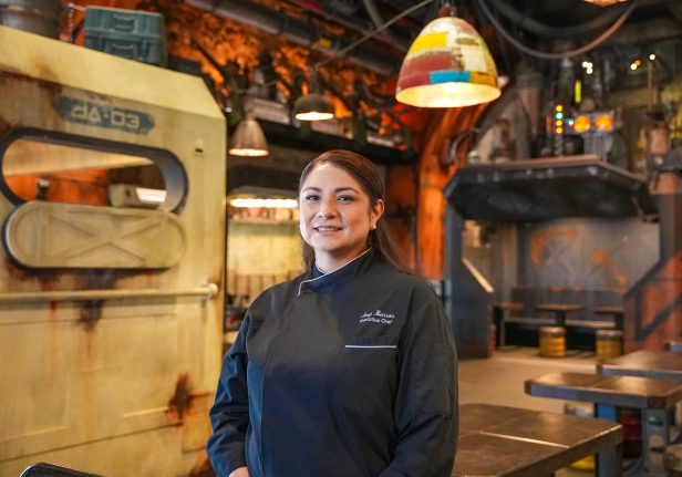 Executive Chef Amy Benson smiles in Docking Bay 7 Food and Cargo at Star Wars: Galaxy’s Edge. 