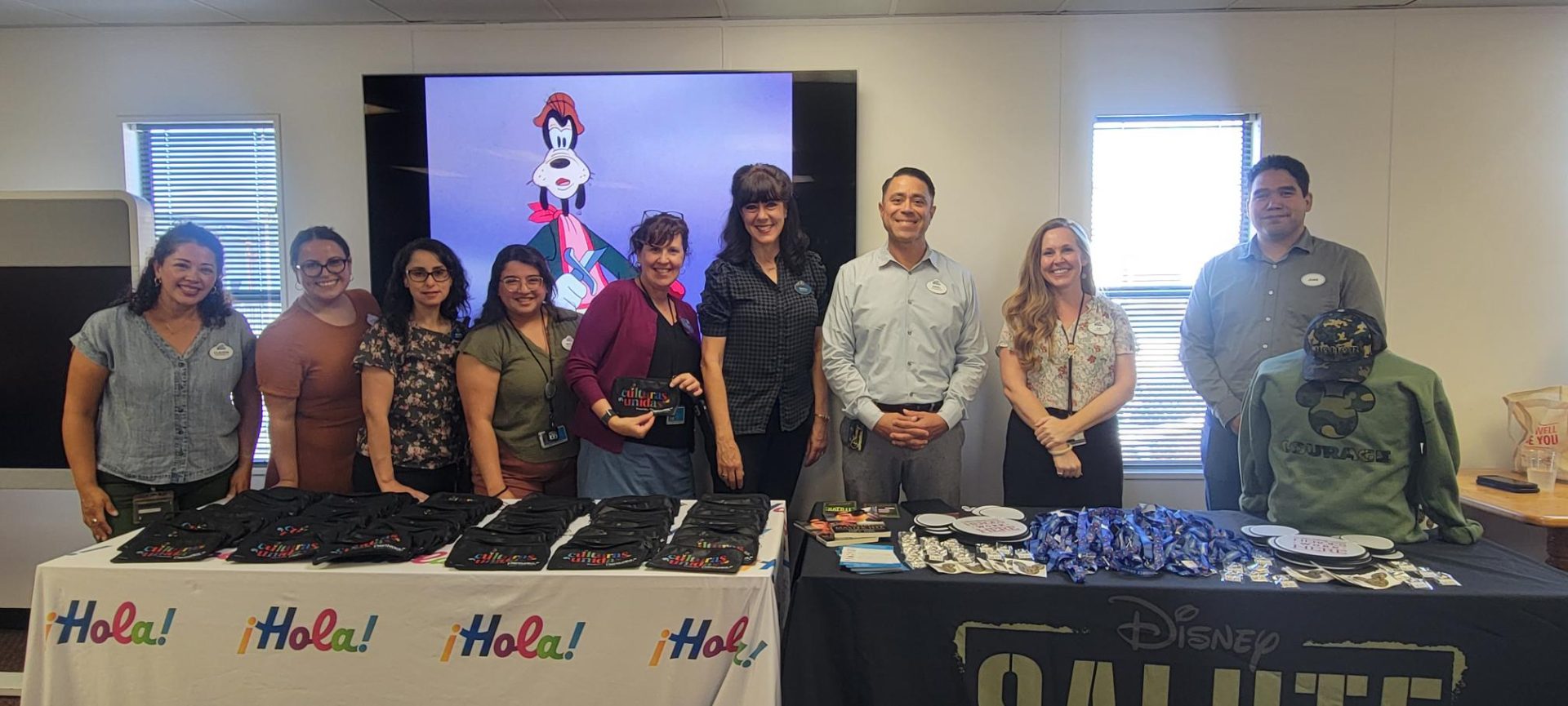 Juan, right, and his mentor Ariel, third from the right, representing SALUTE at a BERG event at the Disneyland Resort.