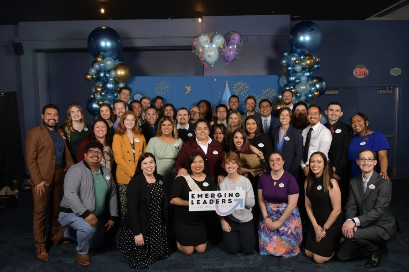 A cohort of the Emerging Leaders program proudly pose together with Operations Leadership Development Managers, Valerie Means and Danny Chase, in February 2024.