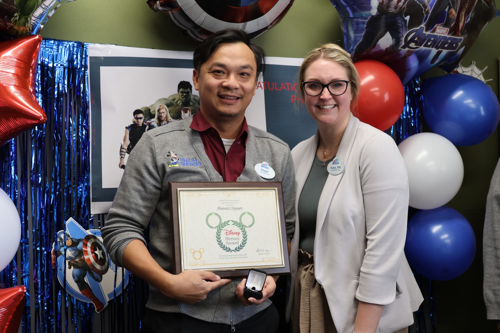 Phat Nguyen stands alongside fellow Disney Heroes Award recipient, Occupational Nurse Manager Kate Young.