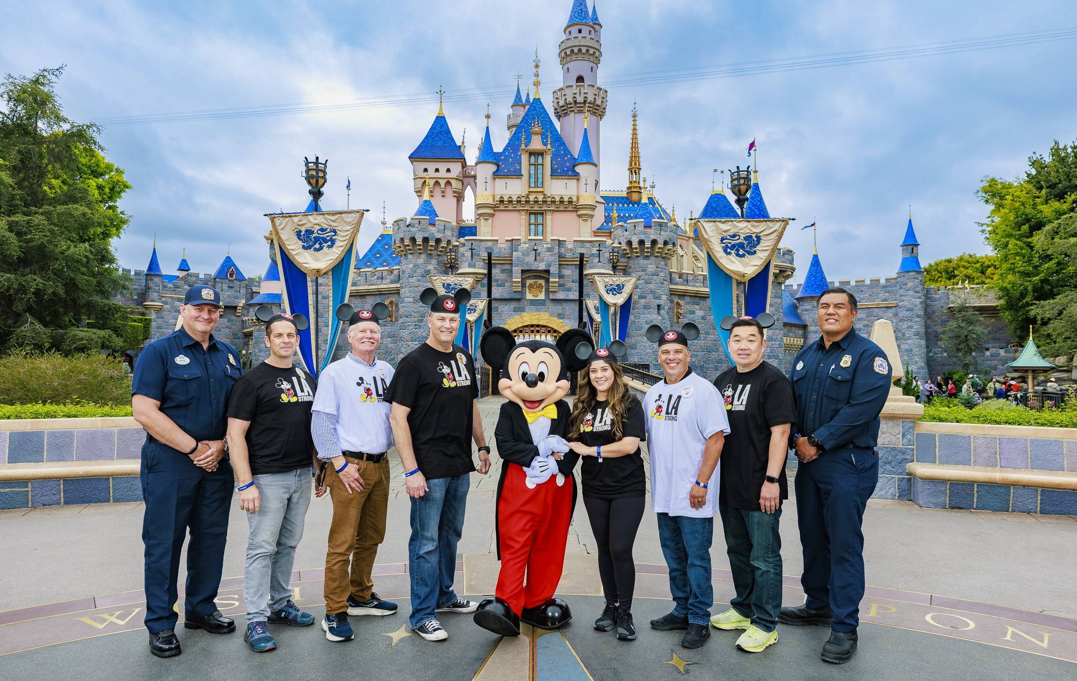 Heroes of the LA fires honored by Disneyland Resort at Sleeping Beauty Castle with Mickey Mouse.